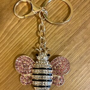 Bee bag tag/key chain with pink, clear rhinestones on a gold tone chain 4 1/2”